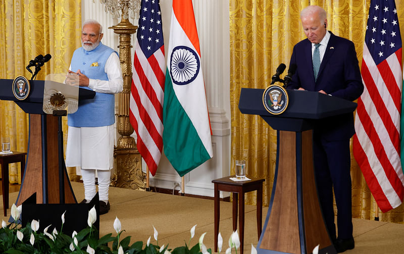 India’s prime minister Narendra Modi answers a question as US President Joe Biden listens during a joint press conference at the White House in Washington, US 22 June 2023.