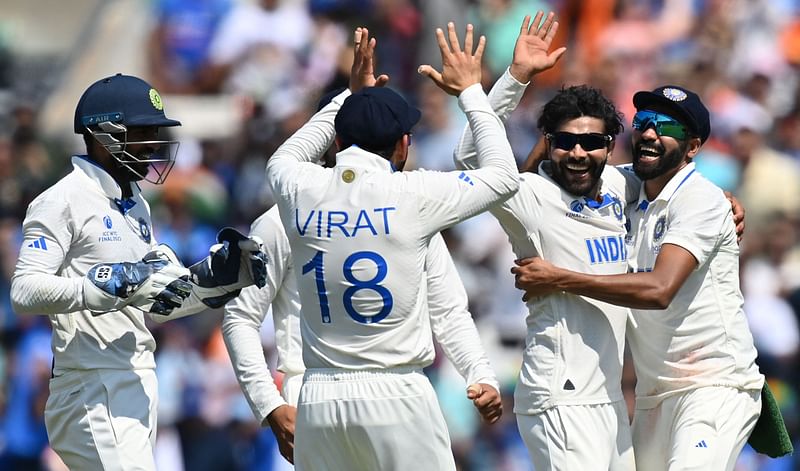 India's Ravindra Jadeja celebrates with teammates after the dismissal of Australia's Cameron Green during play on day 4 of the ICC World Test Championship final match between Australia and India at The Oval, in London on 10 June 2023