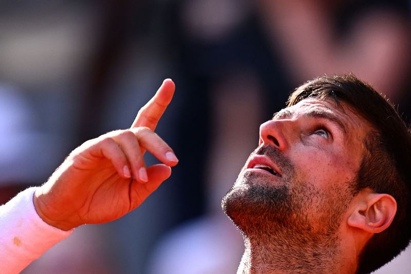 Serbia's Novak Djokovic gestures as he celebrates his victory over Spain's Carlos Alcaraz Garfia during their men's singles semi-final match on day thirteen of the Roland-Garros Open tennis tournament at the Court Philippe-Chatrier in Paris on 9 June, 2023.