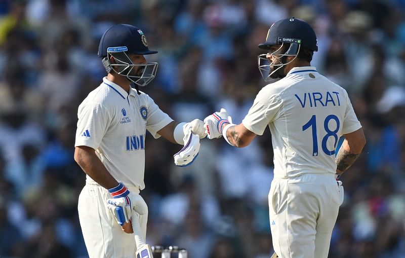 India’s Ajinkya Rahane (L) and India’s Virat Kohli touch gloves during play on day 4 of the ICC World Test Championship cricket final match between Australia and India at The Oval, in London, on 10 June, 2023