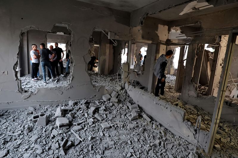 People check a demolished building in Nablus in the occupied West Bank early on June 15, 2023, after Israeli forces blew up the interior of a house belonging to a Palestinian man imprisoned in Israel