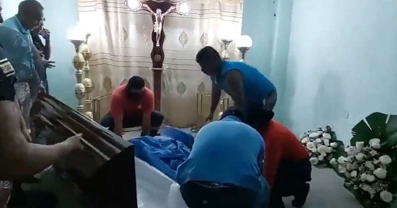 A video posted on Twitter shows Bella Montoya, 76, in her open coffin breathing heavily while two men assist her