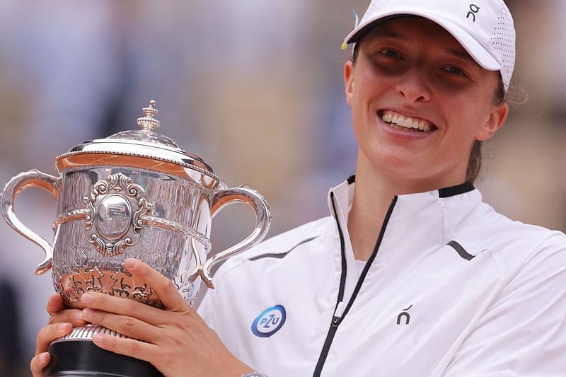 Poland's Iga Swiatek poses with the trophy Suzanne Lenglen following her victory over Czech Republic's Karolina Muchova during their women's singles final match on day fourteen of the Roland-Garros Open tennis tournament at the Court Philippe-Chatrier in Paris on 10 June, 2023