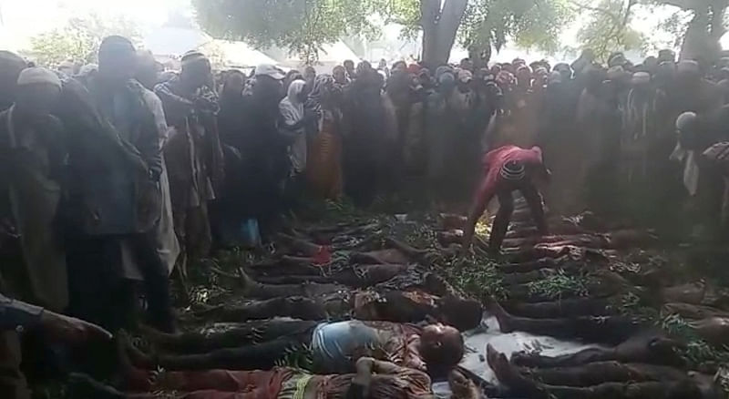 The bodies of Fulani herdsmen killed in an airstrike in Akwanaja village, Nigeria, January 24, 2023, are prepared for a burial ceremony in Doma in a screengrab made from video shot January 25, 2023 and provided to Reuters, June 2, 2023