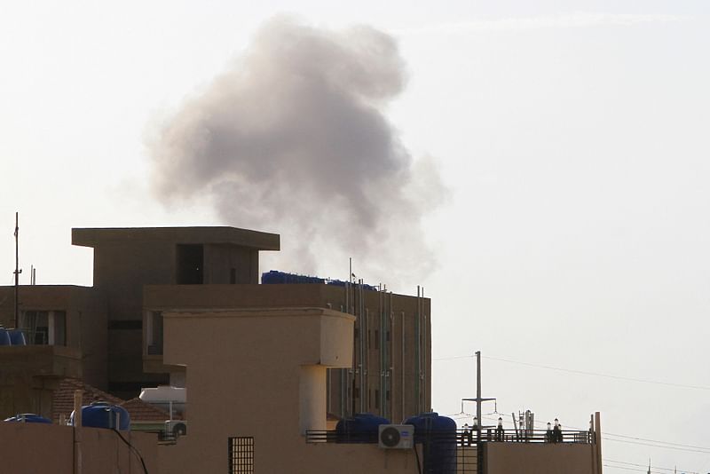 Smoke billows behind buildings in Khartoum on June 2, 2023, as fighting between Sudan's warring generals intensified