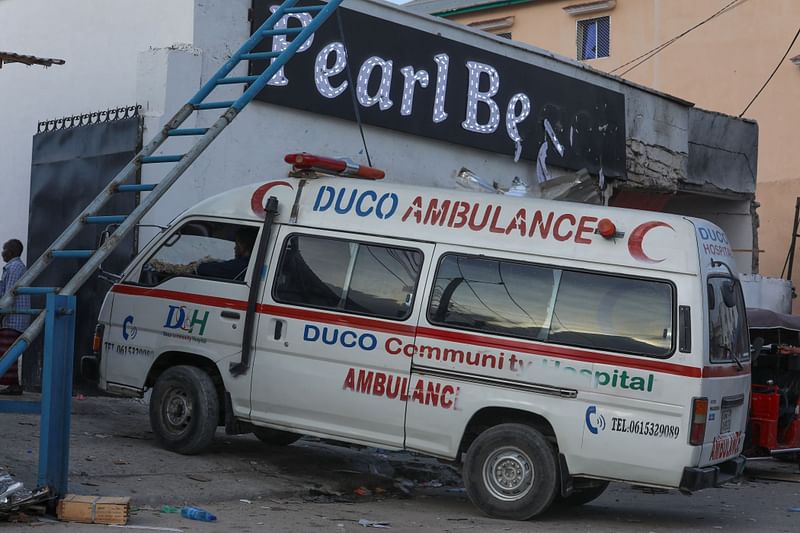 An ambulance enters the site of an attack at the Pearl Beach Hotel in Mogadishu on 10 June, 2023