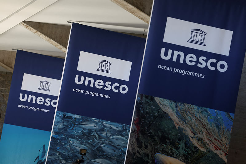 Banners hang at the UNESCO headquarters, on the day of the opening of the second session of negotiations around a future treaty on tackling plastic pollution, in Paris, France, 29 May, 2023.