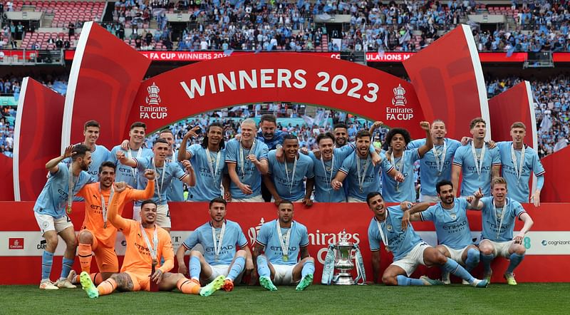 Manchester City players celebrate winning the English FA Cup final football match between Manchester City and Manchester United at Wembley stadium, in London, on 3 June, 2023.