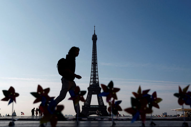 Decorative windmills installed by activists with Glasgow Actions Team and 350.org are seen on the Trocadero Square in front of the Eiffel Tower to welcome world leaders on the eve of the Summit for a New Global Financial Pact, in Paris, France, June 21, 2023