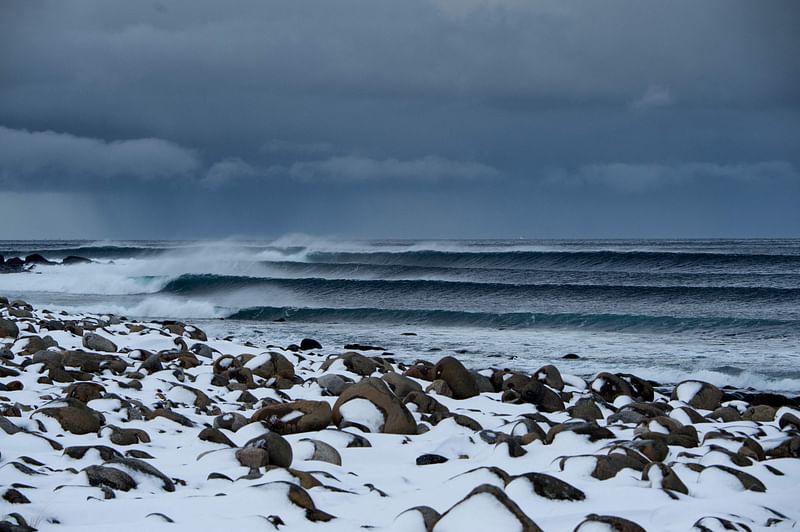 Surfing swell is photographed at snowy beach of Unstad, Norway on Lofoten Island, Arctic Circle, on 9 March, 2016. 8 June, 2023 will mark "World Oceans Day", an initiative launched in 1992 to raise awareness on the topic of the planet's oceans.