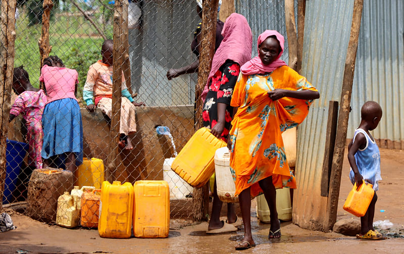 Sudanese refugees collect water from a tap at the Gorom Refugee camp hosting Sudanese refugees on World Refugee Day, to celebrate the strength and courage of people who have been forced to flee their home country to escape conflict under the theme "hope away from home" near Juba, in South Sudan June 20, 2023