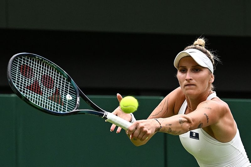 Czech Republic's Marketa Vondrousova returns the ball to Ukraine's Elina Svitolina during their women's singles semi-finals tennis match on the eleventh day of the 2023 Wimbledon Championships at The All England Lawn Tennis Club in Wimbledon, southwest London, on 13 July, 2023.