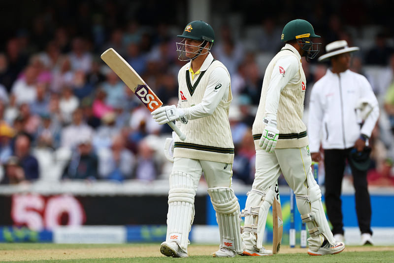 Australia's David Warner celebrates after reaching his half century