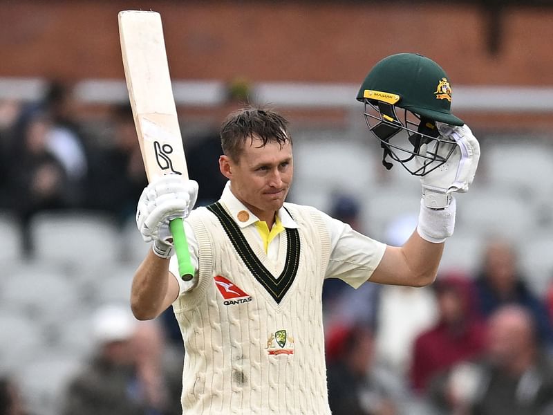 Australia's Marnus Labuschagne celebrates reaching 100 on day four of the fourth Ashes Test at Old Trafford cricket ground in Manchester, England on 22 July 2023