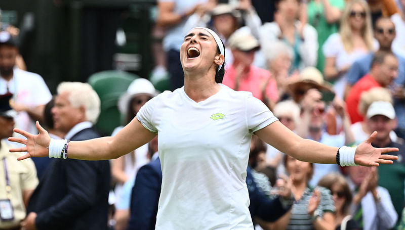 Tunisia's Ons Jabeur celebrates beating Kazakhstan's Elena Rybakina during their women's singles quarter-finals tennis match on the tenth day of the 2023 Wimbledon Championships at The All England Lawn Tennis Club in Wimbledon, southwest London, on 12 July, 2023