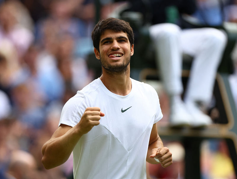 Spanish tennis player Carlos Alcaraz celebrates after defeating Holger Rune to reach Wimbledon semi-final for the first time