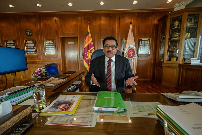 In this photograph taken on July 6, 2023, Sri Lanka's Central Bank Governor Nandalal Weerasinghe speaks during an interview with AFP at his office in Colombo