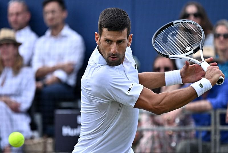 Serbia's Novak Djokovic returns to US player Frances Tiafoe during their men's singles exhibition match at The Giorgio Armani Tennis Classic tournament at the Hurlingham Club in London on 29 June, 2023