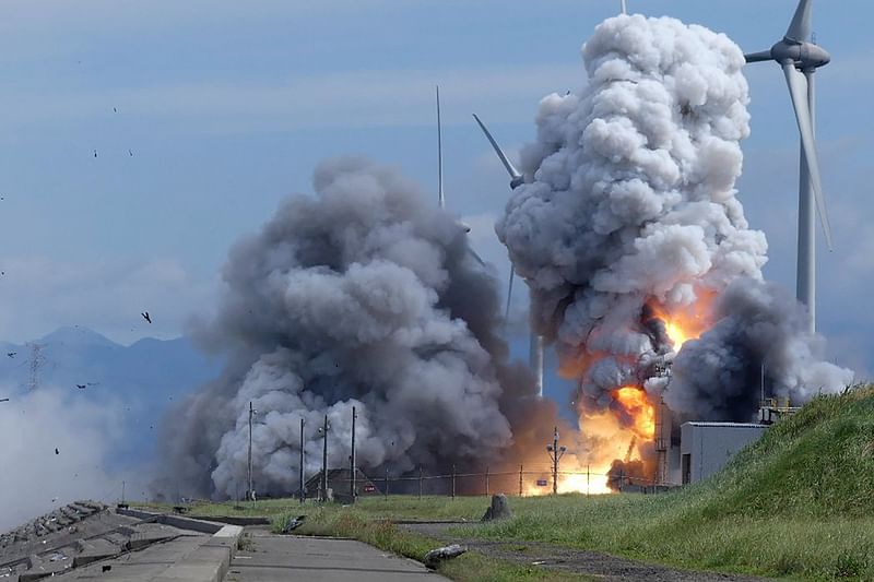 This handout picture taken on 14 July, 2023 by photographer Minoru Otsuka and received via Jiji Press shows a Japanese rocket engine exploding during a combustion test at the Noshiro Testing Center in Noshiro, Akita Prefecture