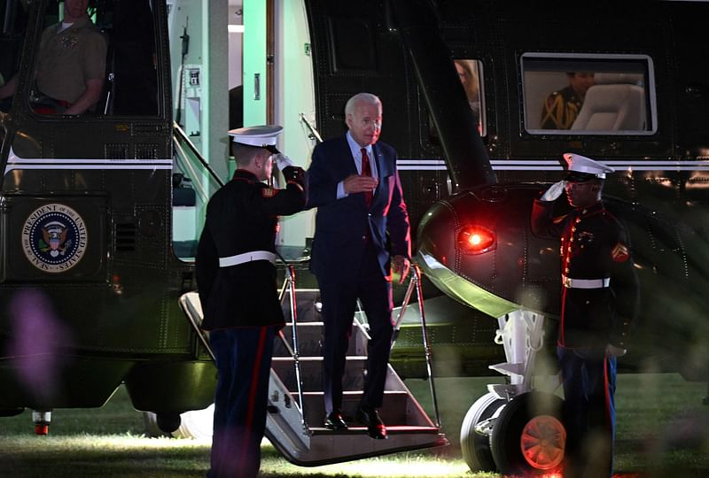 US President Joe Biden disembarks Marine One at Winfield House Landing Zone in London on 9 July, 2023