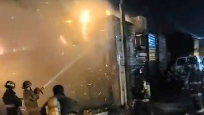 Firefighters work at the scene, following a suspected arson attack at a bar in San Luis Rio Colorado, Mexico on 22 July, 2023, in this screen grab obtained from a handout video.