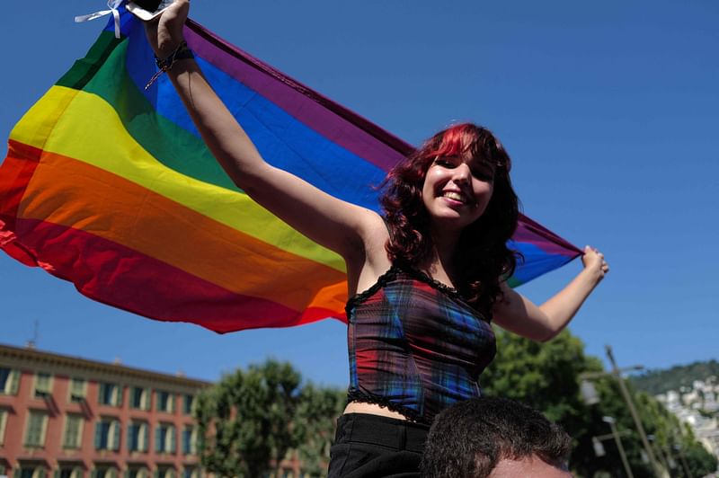 A partcipant takes part in the "Pink Parade", a Lesbian, Gay, Bisexual and Transgender (LGBT) Pride celebration in Nice, southeastern France, on July 9, 2023