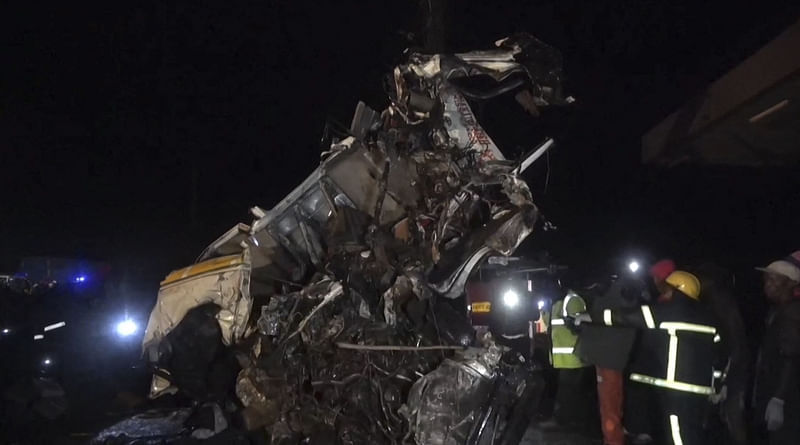 This video grab taken from an AFPTV video on 30 June, 2023 shows the wreckage of a vehicle on the scene after an accident on the highway between the towns of Kericho and Nakuru