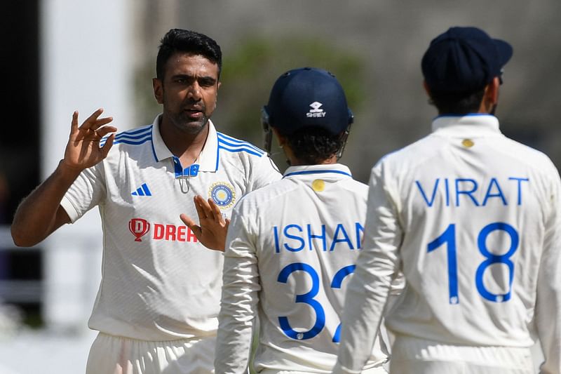 Ravichandran Ashwin (L), of India, celebrates the dismissal of Jermaine Blackwood, of West Indies, during day three of the First Test between West Indies and India at Windsor Park in Roseau, Dominica, on 14 July, 2023