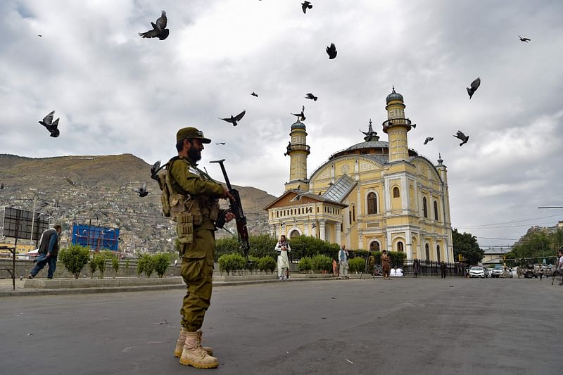 A Taliban security personnel stands guard outside the Shah-e Doh Shamshira mosque ahead of Muslim festival Eid al-Adha in Kabul on 28 June, 2023