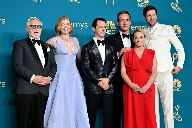 (L-R) Actors Brian Cox, Sarah Snook, Jeremy Strong, Matthew Macfayden, J. Smith-Cameron, and actor Nicholas Braun pose after winning the Emmy for Outstanding Drama Series for "Succession" during the 74th Emmy Awards at the Microsoft Theater in Los Angeles, California, on September 12, 2022