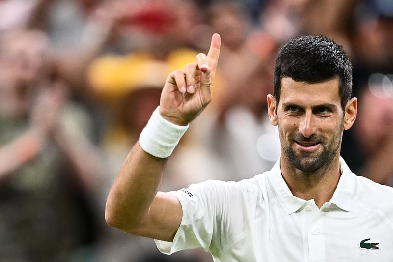 Serbia's Novak Djokovic celebrates winning against Switzerland's Stan Wawrinka during their men's singles tennis match on the fifth day of the 2023 Wimbledon Championships at The All England Tennis Club in Wimbledon, southwest London, on 7 July, 2023