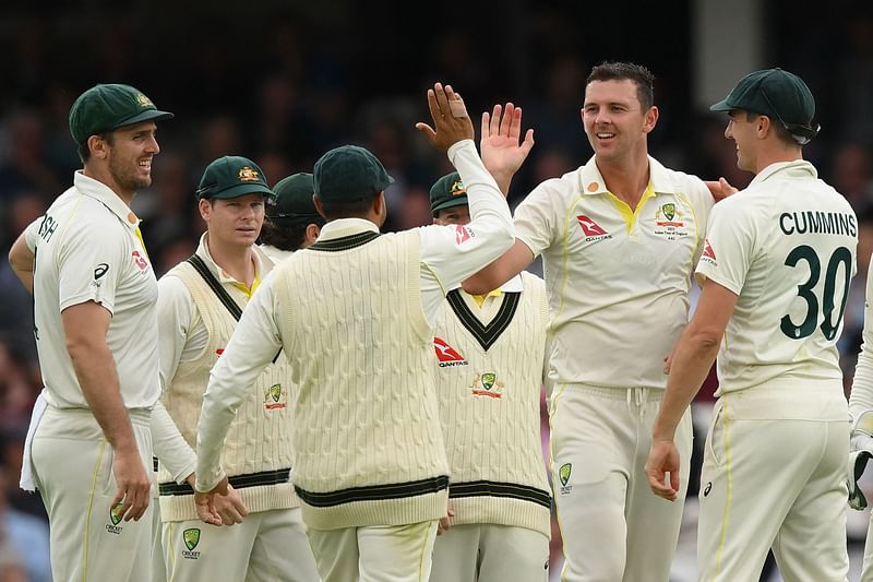 Australia's Josh Hazlewood (2R) celebrates with teammates after bowling England's Jonny Bairstow on the opening day of the fifth Ashes cricket Test match between England and Australia at The Oval cricket ground in London on July 27, 2023