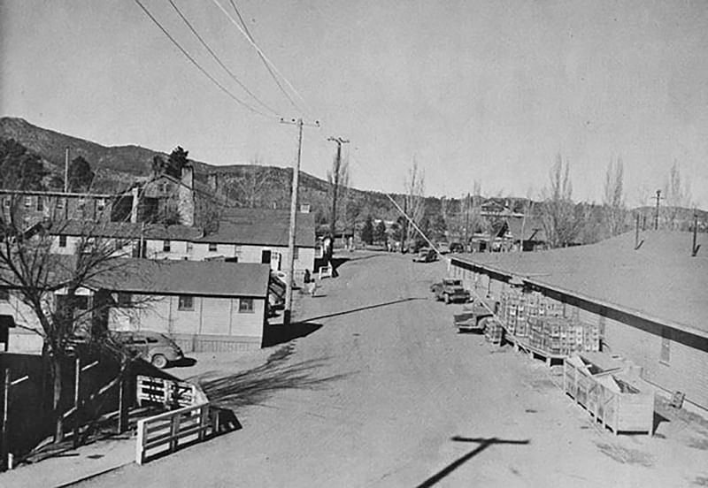 The town of Los Alamos, New Mexico with Fuller Lodge and the "Big House" dormitories is seen in an undated photograph.