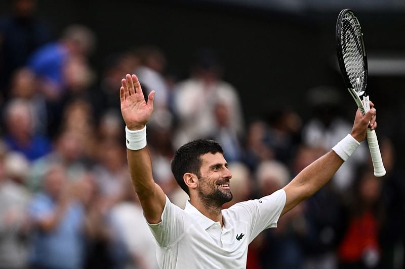 Serbia's Novak Djokovic celebrates winning against Italy's Jannik Sinner during their men's singles semi-finals tennis match on the twelfth day of the 2023 Wimbledon Championships at The All England Lawn Tennis Club in Wimbledon, southwest London, on 14 July, 2023