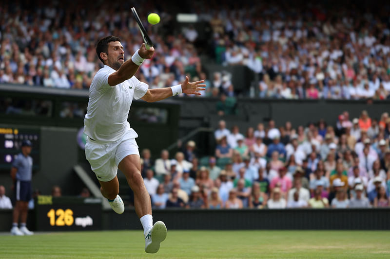 Serbia's Novak Djokovic returns the ball to Poland's Hubert Hurkacz during their men's singles tennis match on the eighth day of the 2023 Wimbledon Championships at The All England Tennis Club in Wimbledon, London on 10 July 2023