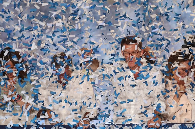 The leader and candidate of conservative Partido Popular (People’s Party) Alberto Nunez Feijoo gestures as he addresses supporters from a balcony of the PP headquarters in Madrid after Spain’s general election on 23 July, 2023