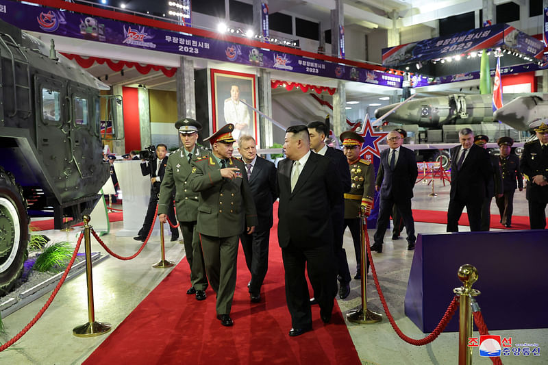 North Korean leader Kim Jong Un and Russia's Defense Minister Sergei Shoigu visit an exhibition of armed equipment on the occasion of the 70th anniversary of the Korean War armistice in this image released by North Korea's Korean Central News Agency on July 27, 2023