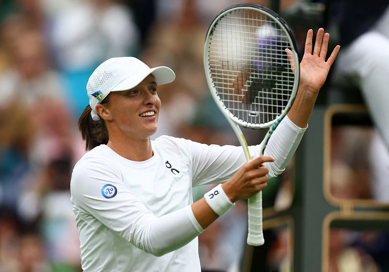 Poland's Iga Swiatek celebrates winning her first round match against China's Zhu Lin