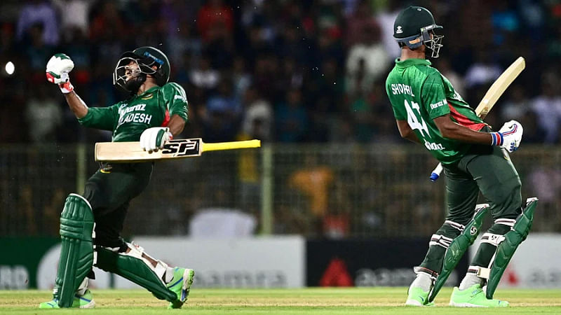 Towhid Hridoy and Shoriful Islam celebrate after completing the win for Bangladesh against Afghanistan in the first T20 at the Sylhet International Cricket Stadium on 14 July 2023