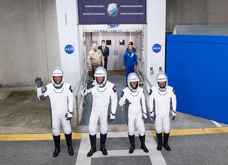 This handout picture courtesy of NASA taken on 26 August, 2023, shows (From L) Roscosmos cosmonaut Konstantin Borisov, European Space Agency (ESA) astronaut Andreas Mogensen, NASA astronaut Jasmin Moghbeli, and Japan Aerospace Exploration Agency (JAXA) astronaut Satoshi Furukawa, wear SpaceX spacesuits as they prepare to depart the Neil A