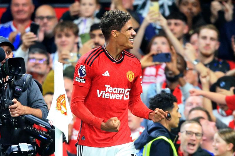 Manchester United's French defender Raphael Varane celebrates scoring the opening goal during the English Premier League match between Manchester United and Wolverhampton Wanderers at Old Trafford in Manchester, England on 14 August 2023