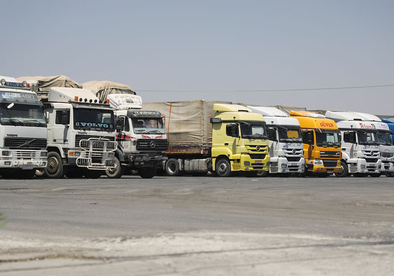 Trucks are parked at Bab al-Salameh border crossing in Aleppo countryside, Syria August 9, 2023