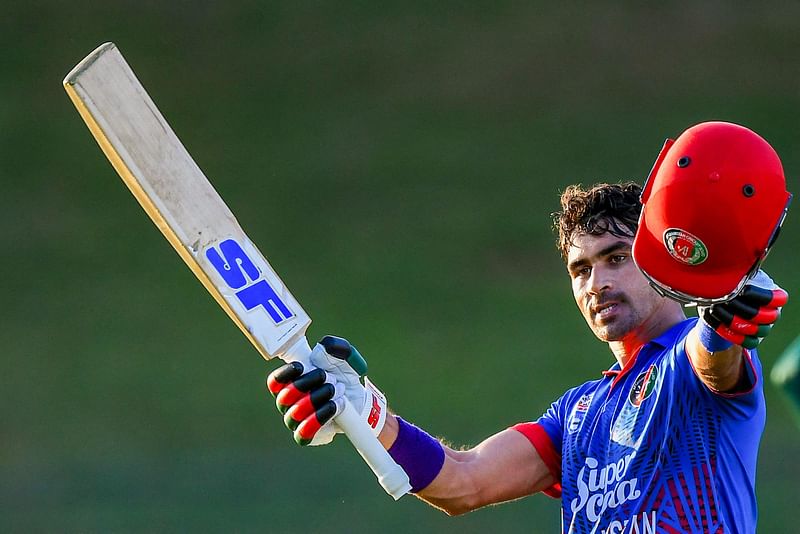 Afghanistan's Rahmanullah Gurbaz celebrates after scoring a century (100 runs) during the second one-day international (ODI) cricket match between Pakistan and Afghanistan at the Mahinda Rajapaksa International Cricket Stadium in Hambantota on August 24, 2023