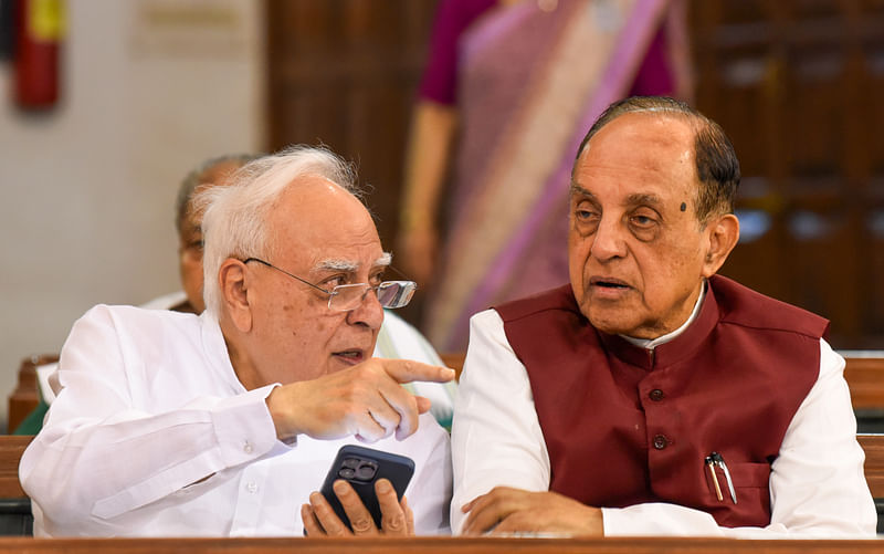 Rajya Sabha MP Kapil Sibal in conversation with Virat Hindustan Sangam President Subramanian Swamy at the Central Hall of Parliament prior to paying tribute to former Prime Minister Rajiv Gandhi on his 79th birth anniversary, in New Delhi on 20 August, 2023