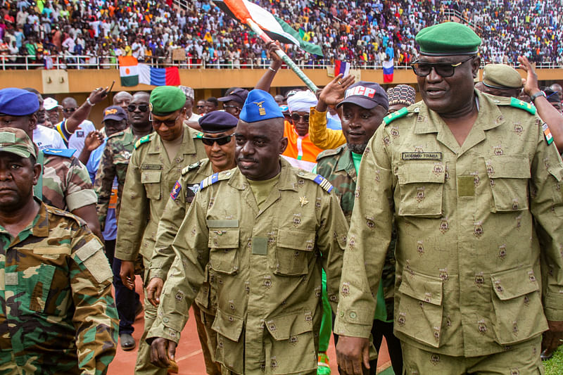 Members of a military council that staged a coup in Niger attend a rally at a stadium in Niamey, Niger, August 6, 2023