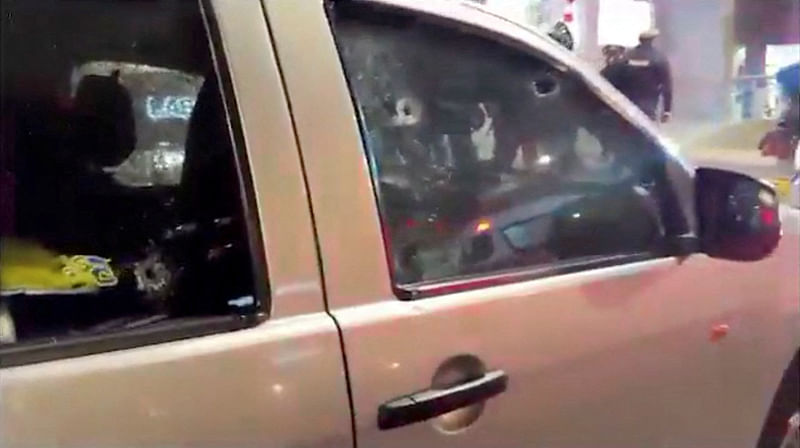 A vehicle with bullet holes on its windows is seen, in the aftermath of the killing of Ecuadorean presidential candidate Fernando Villavicencio, in a location given as Quito, Ecuador in this screen grab from a video released on August 10, 2023