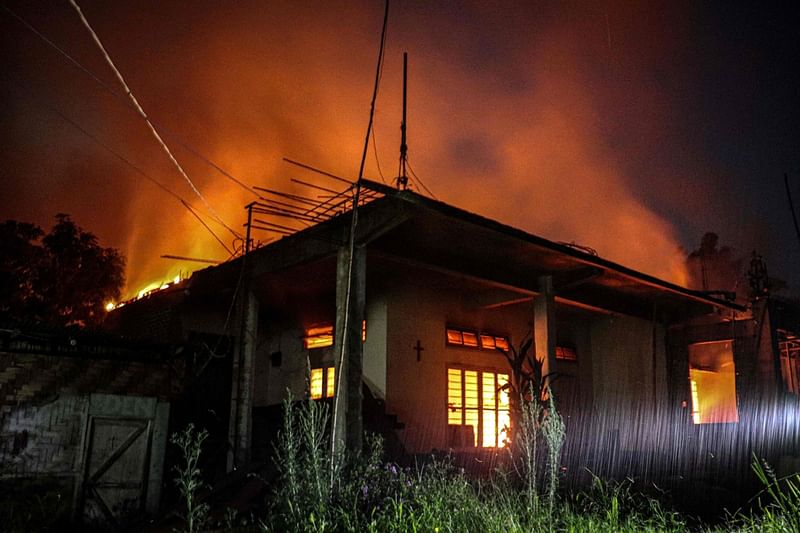 Smoke billows from an abandoned house set on fire by miscreants in the violence-hit state of Manipur, in Imphal on 5 August, 2023. At least 120 people have been killed since May in armed clashes between the predominantly Hindu Meitei majority and the mainly Christian Kuki in the northeastern state of India