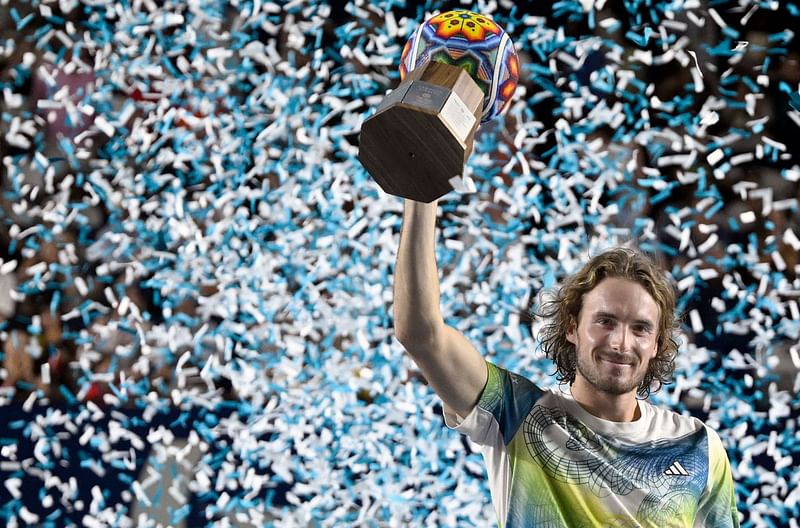 Greece's Stefanos Tsitsipas holds his trophy as he celebrates his victory against Australia's Alex de Minaur during their Mexico ATP Open men's singles final tennis match at Cabo Sports Complex in Los Cabos, Baja California, Mexico, on 5 August 2023