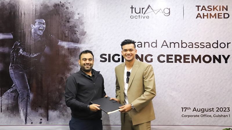 Bangladesh cricketer Taskin Ahmed and founder and director of Turaag Active Faiaz Rahman during the agreement signing ceremony