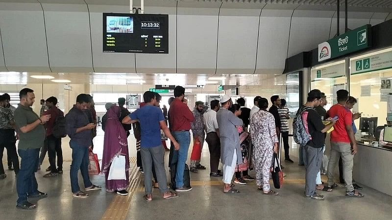 People wait in queue to buy metrorail tickets at Uttara North (Diabari) station at 9:45 am on 9 August, 2023